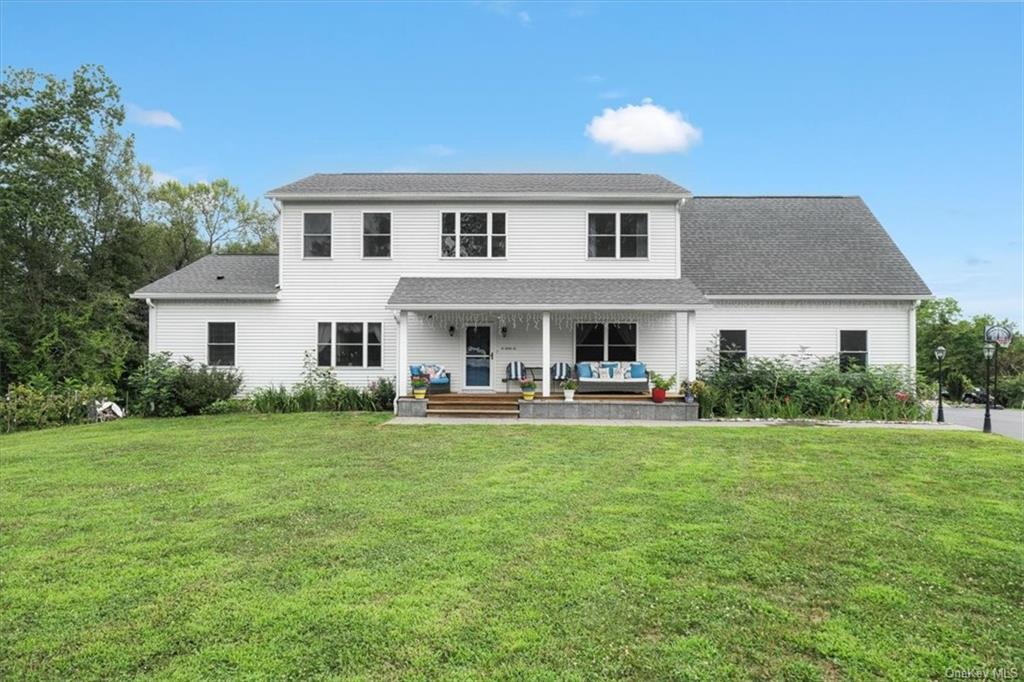 a front view of a house with patio yard and porch