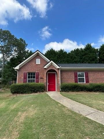 a view of front of house with a yard