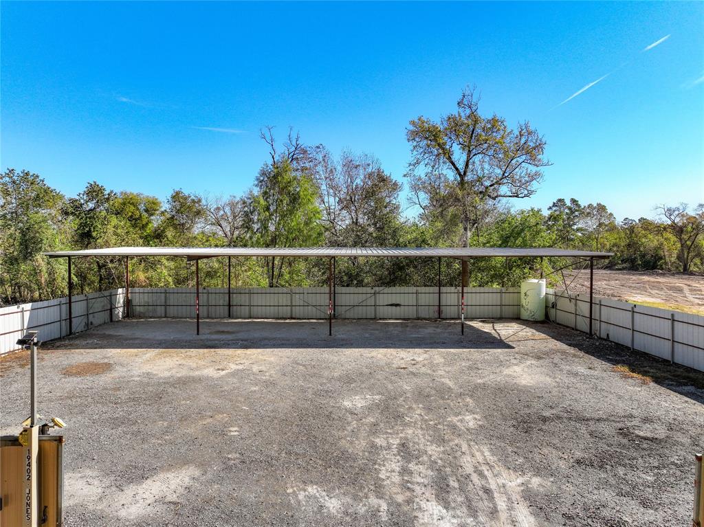 a view of fence with a yard