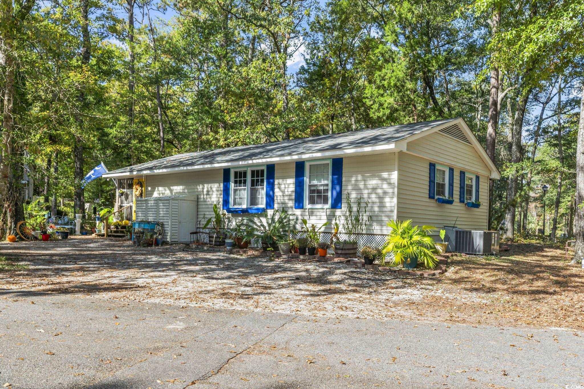 Single story home with cooling unit