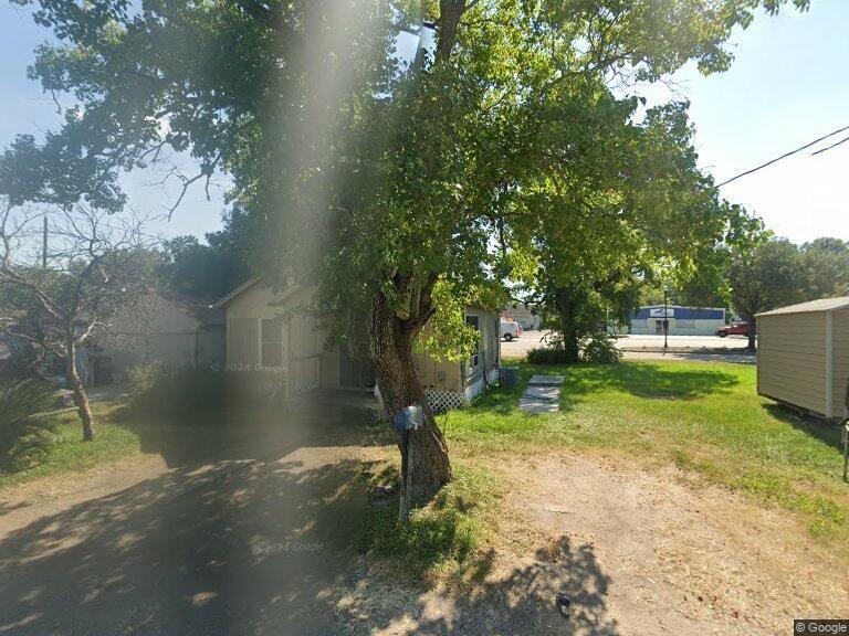 a view of backyard with green space