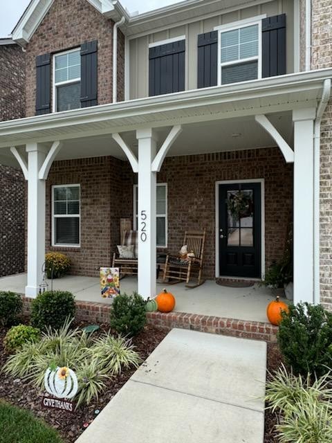 a front view of a house with seating space