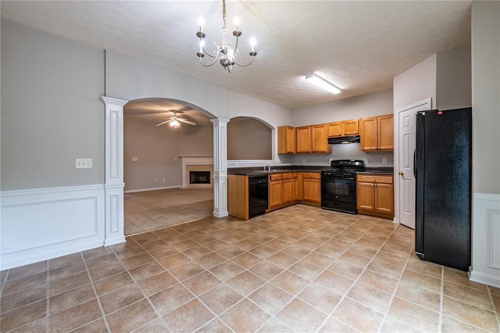 a view of a kitchen with a sink and stainless steel appliances