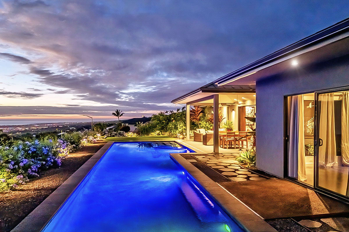 a view of swimming pool with a seating space