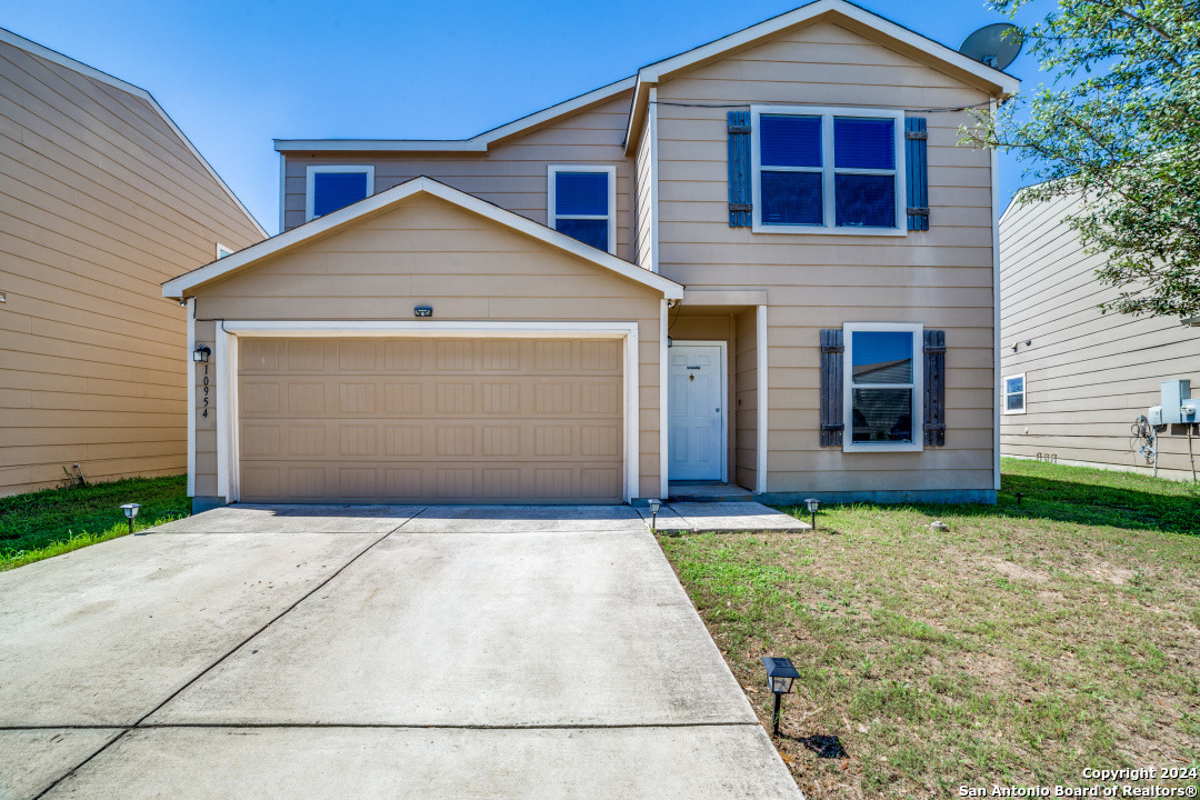 a view of front of house with garage