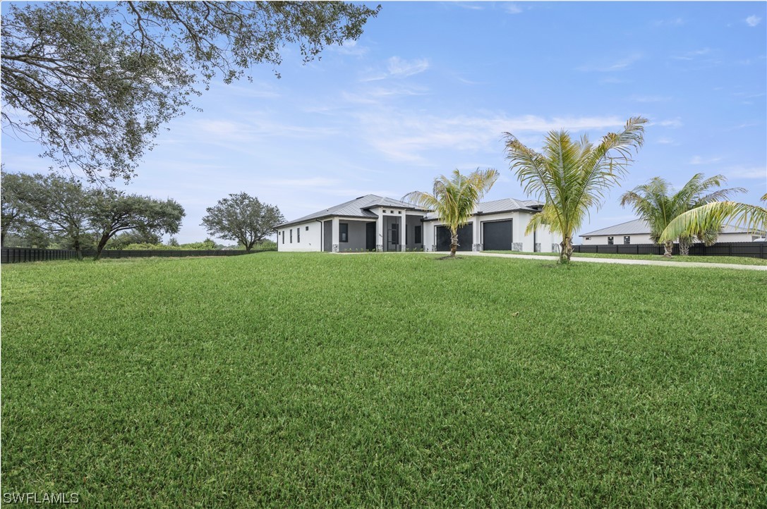 a view of a house with a big yard