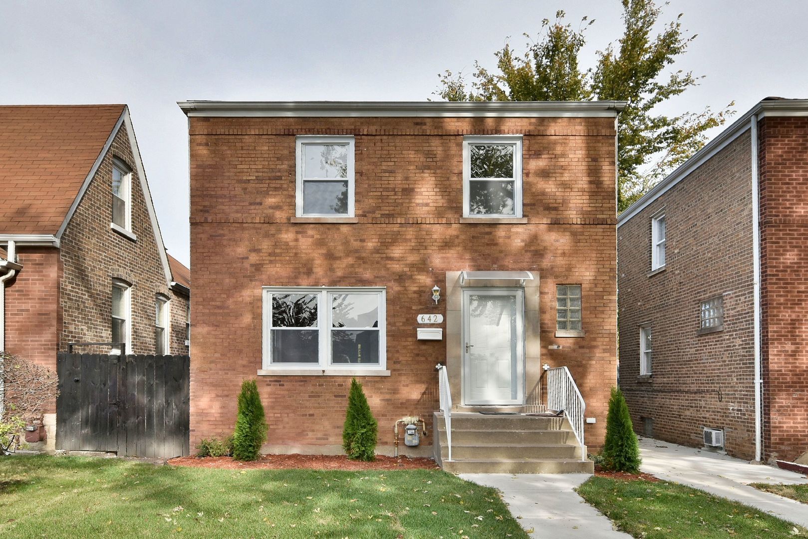 front view of a house with a yard