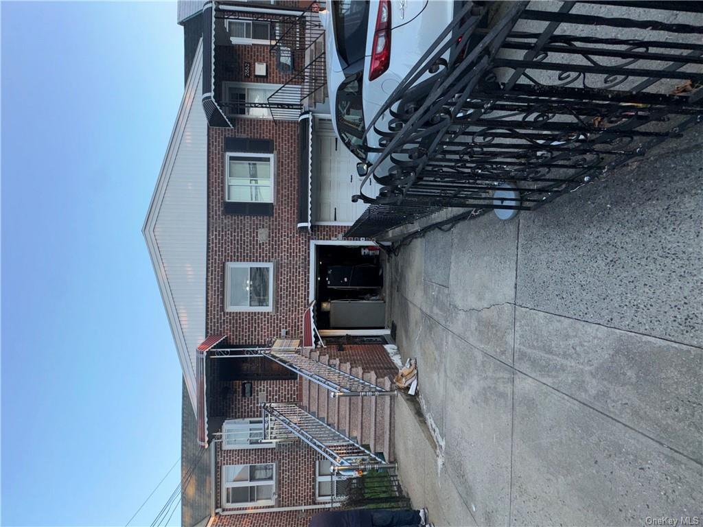 View of front facade featuring a garage