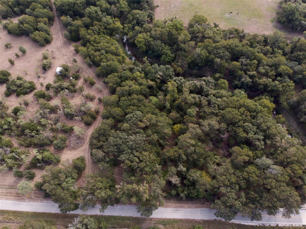 an aerial view of house with yard