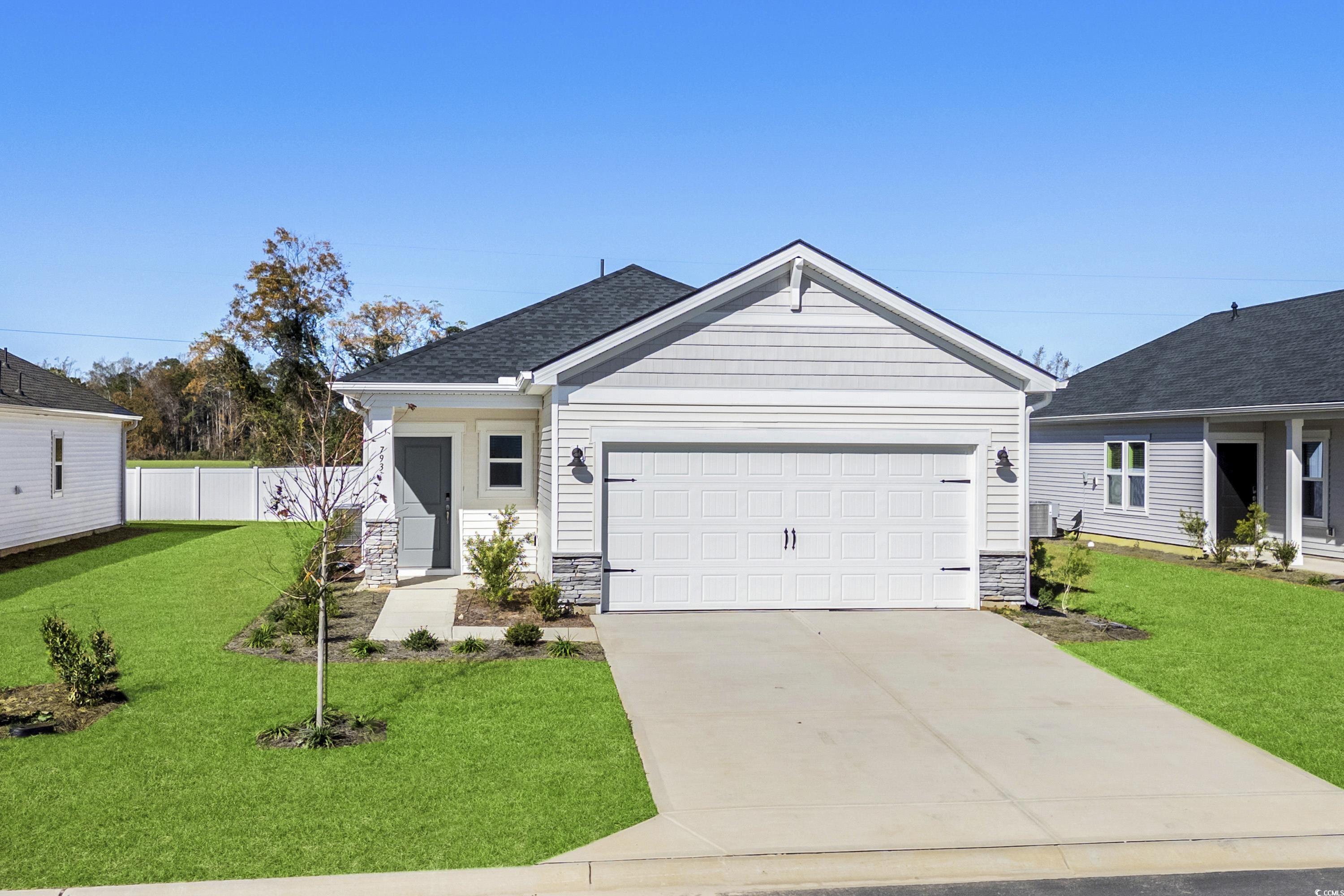 View of front of property with a front yard and a