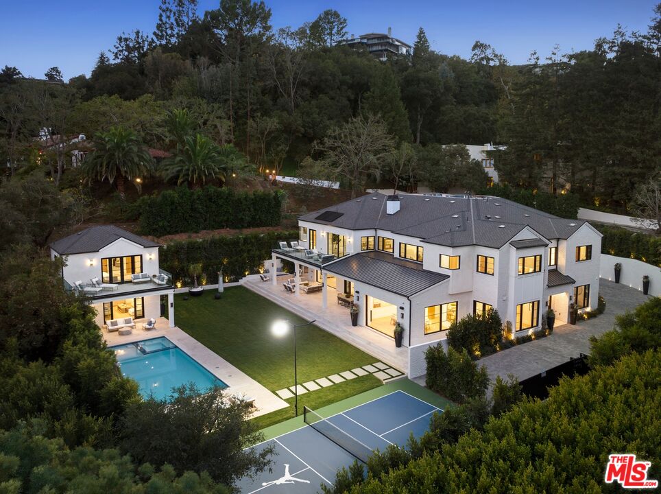 an aerial view of a house with a garden