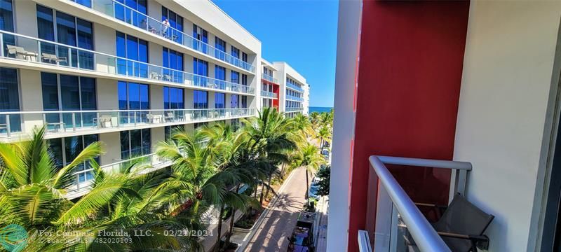 a view of a tall building from a balcony