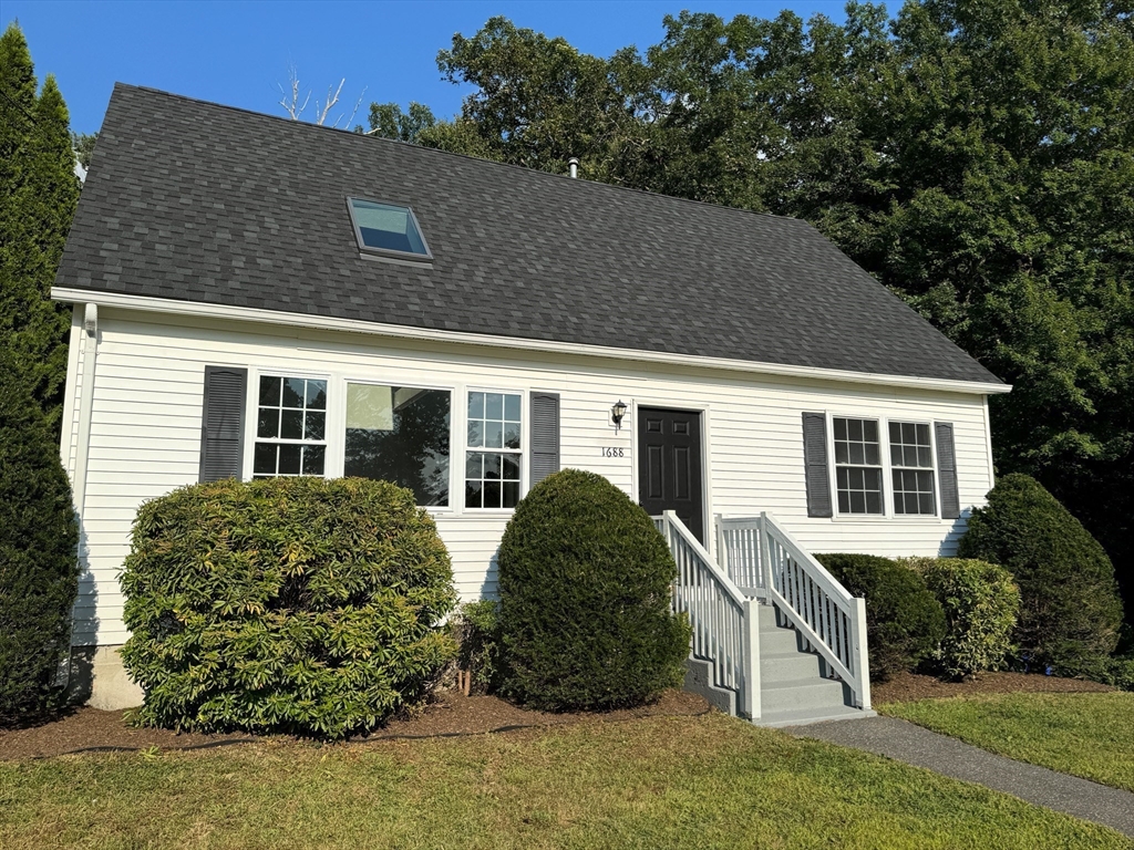 front view of a house with a yard