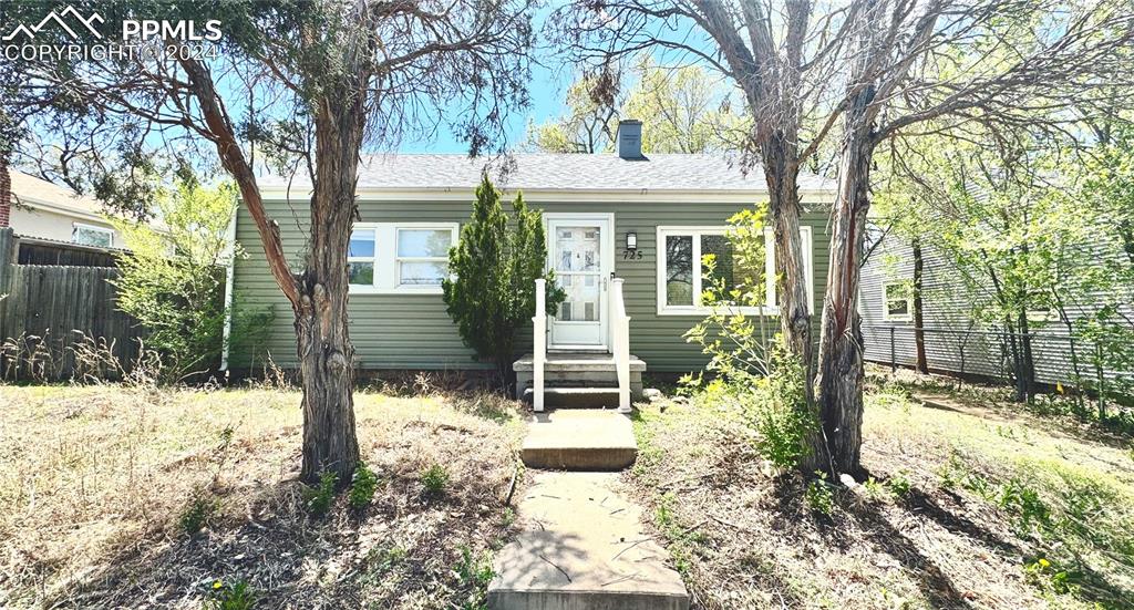 front view of a house with a yard