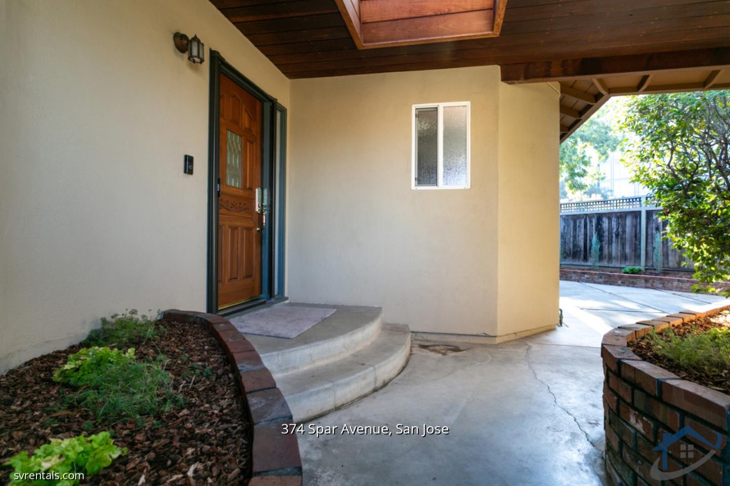 a view of backyard with seating space