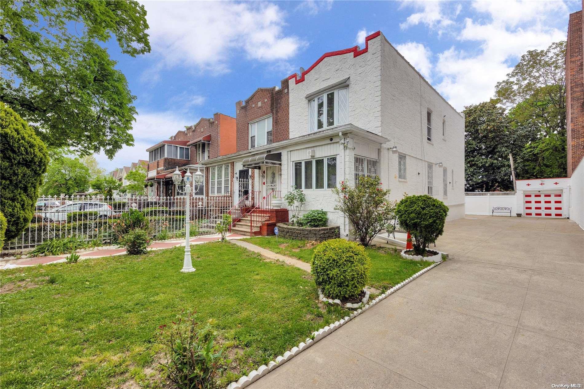 a house view with a sitting space and garden