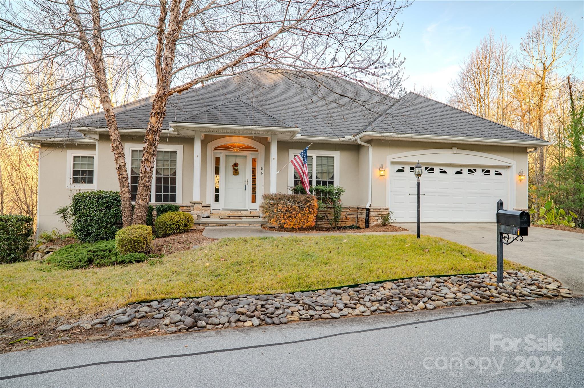 a front view of a house with garden