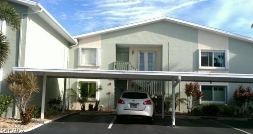 a view of a car park in front of house