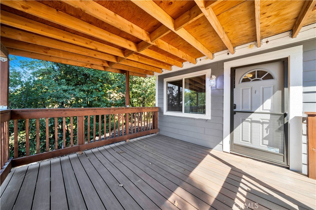 a view of balcony with wooden floor