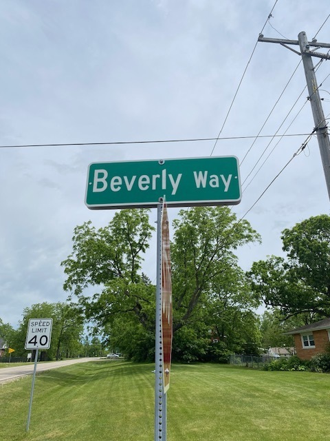 a view of a sign board with yard