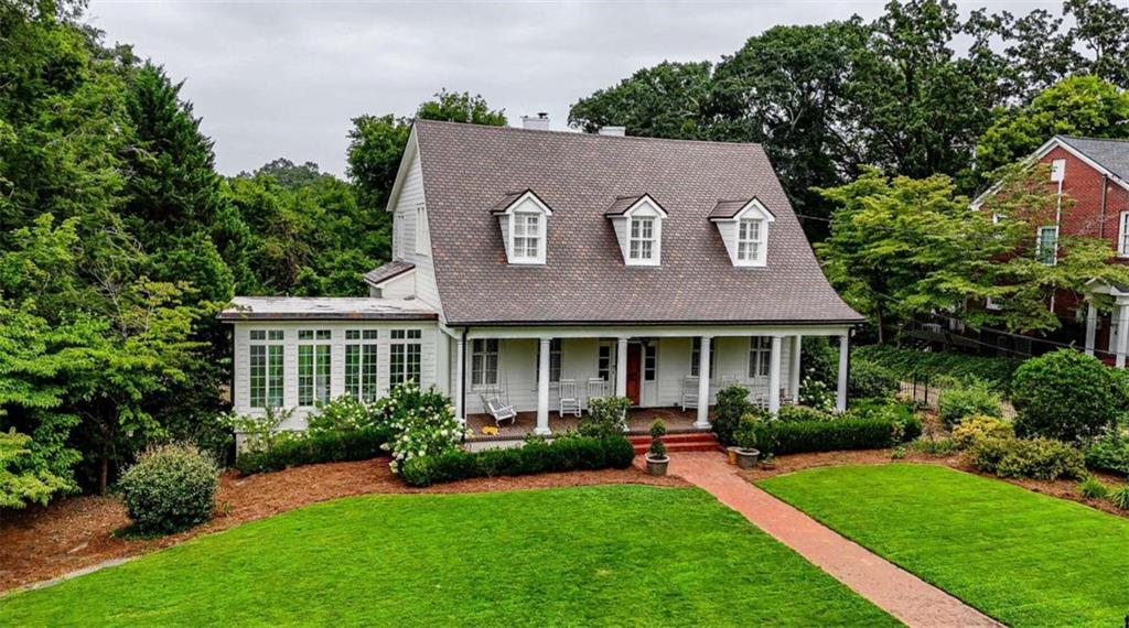 a house with garden in front of it