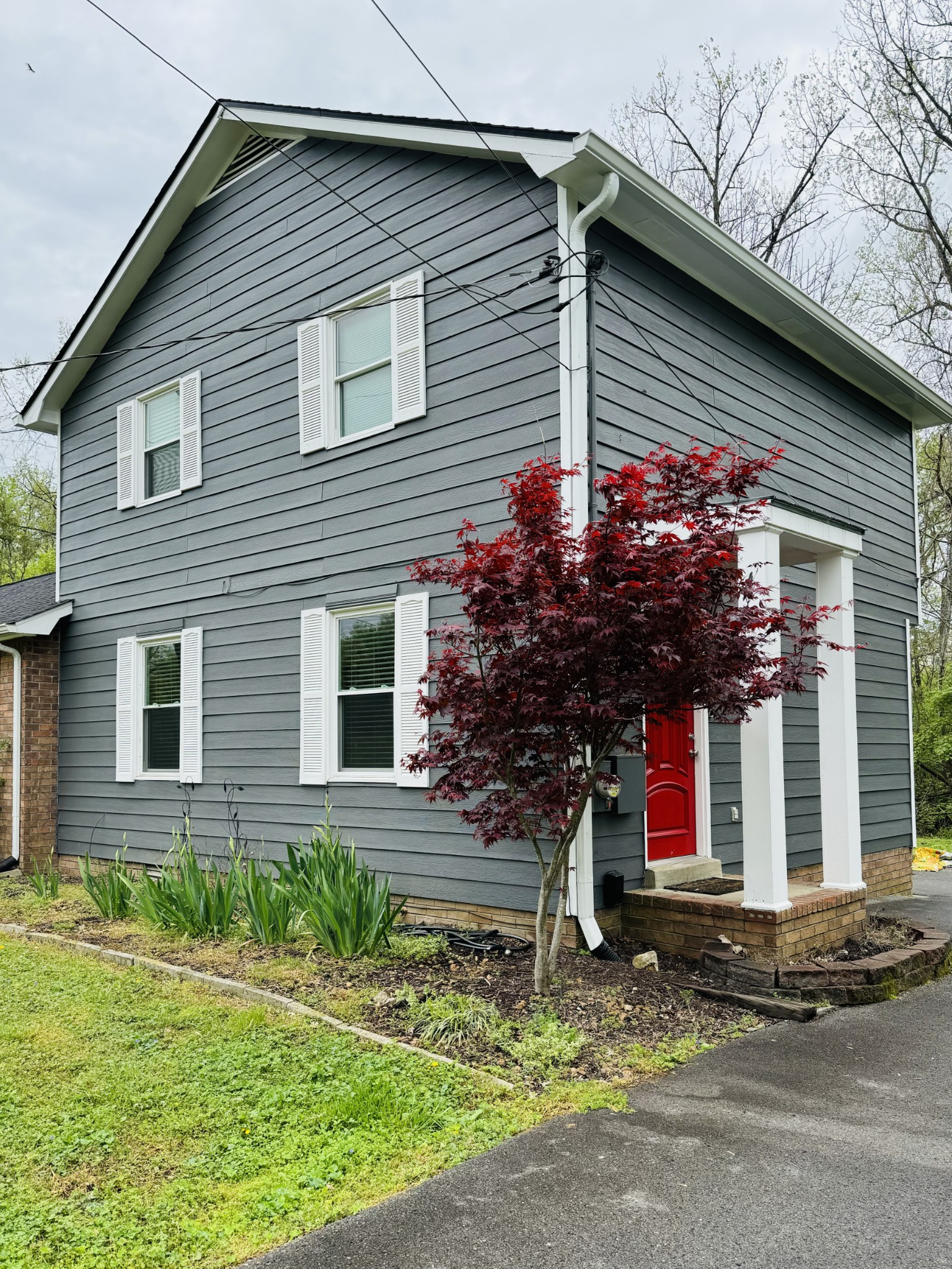 a front view of a house with garden