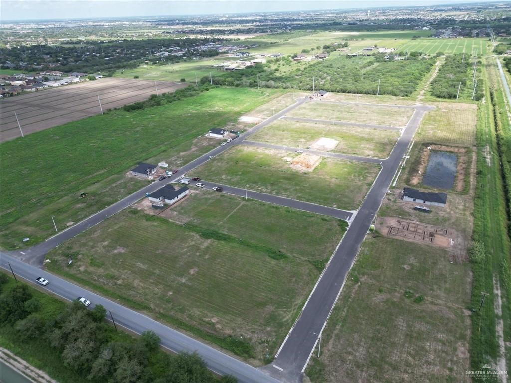 Birds eye view of property featuring a rural view