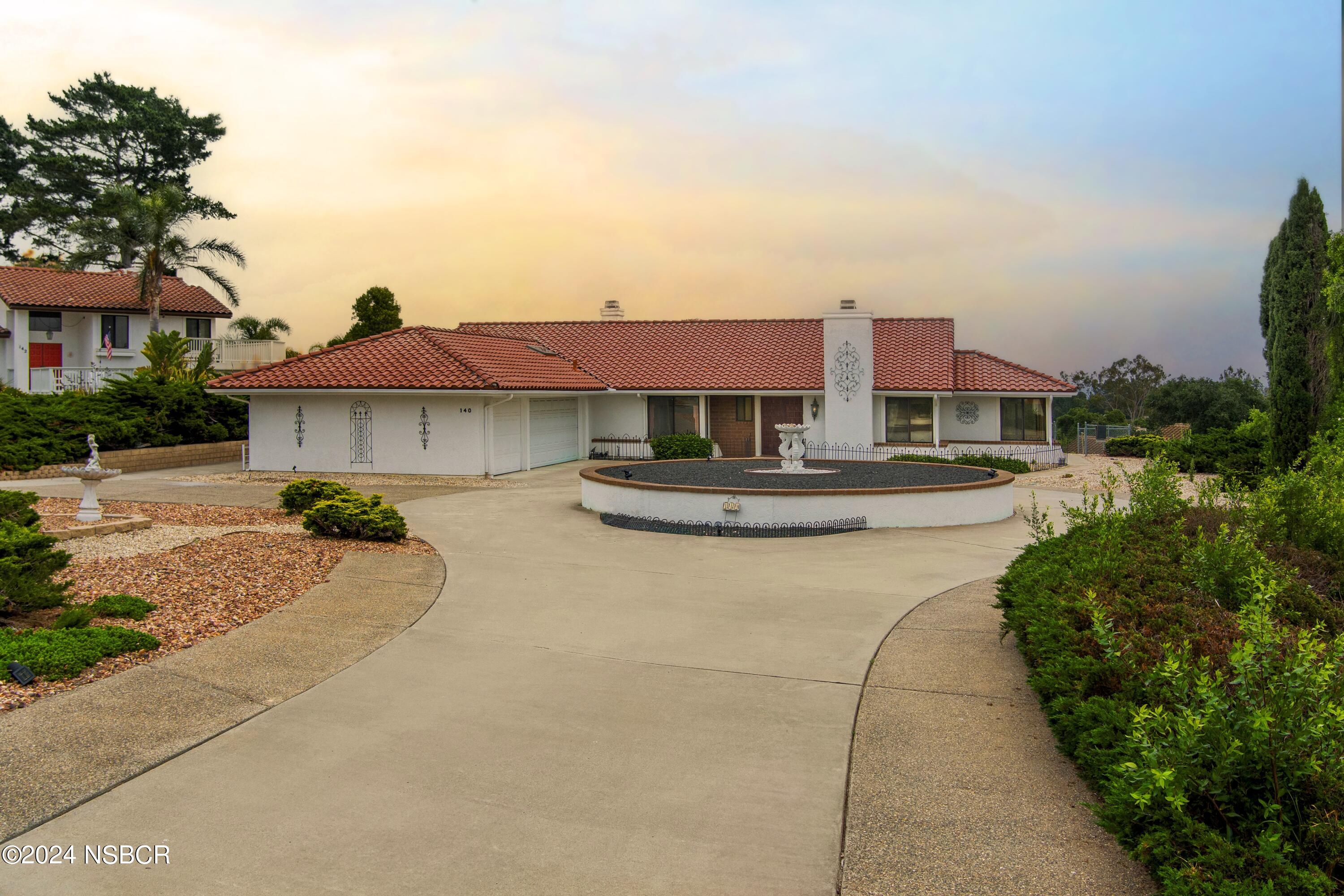 a house view with a outdoor space