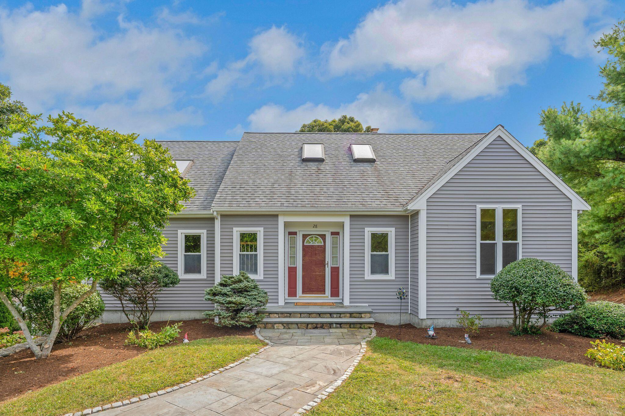 a front view of a house with a yard