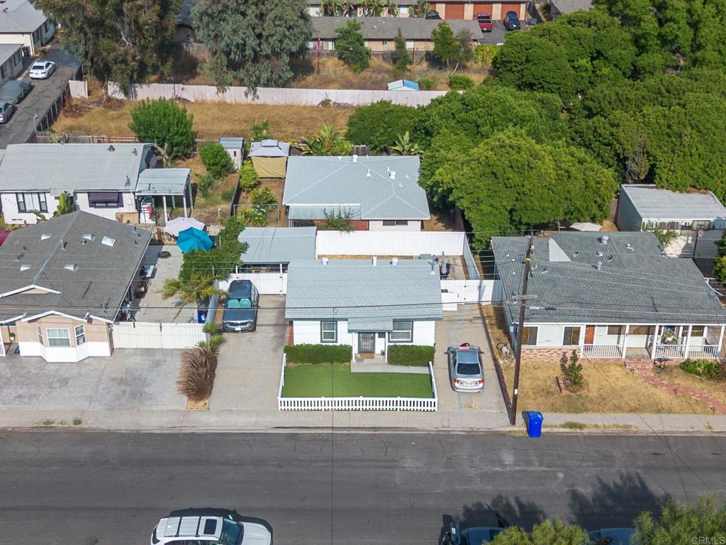 an aerial view of a house with yard