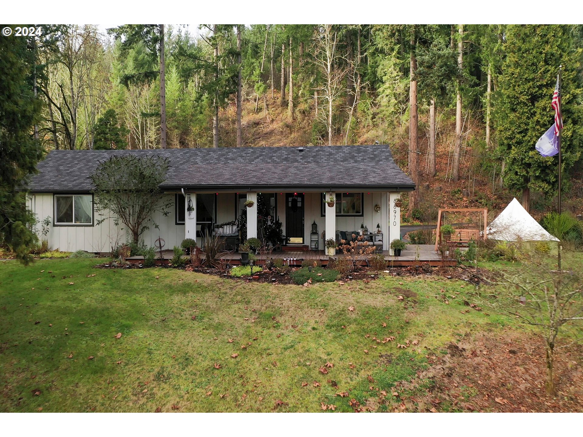 a view of a house with backyard porch and furniture