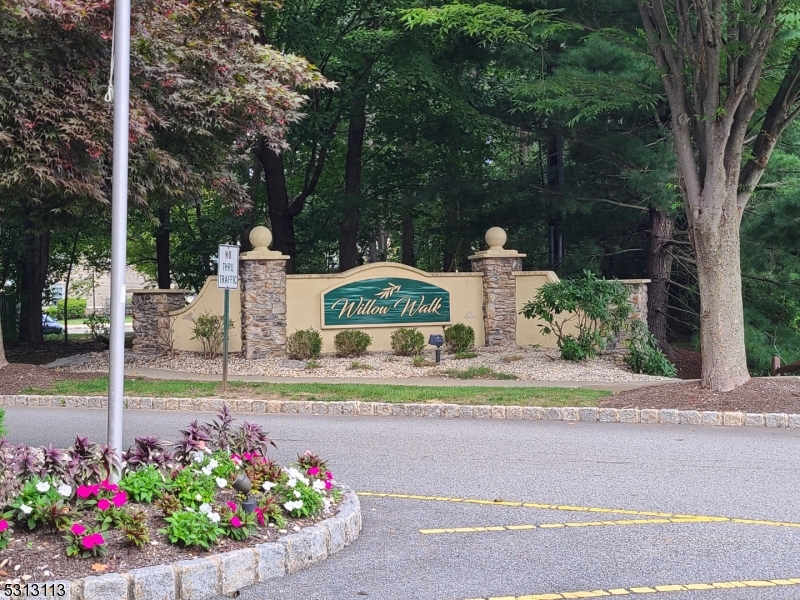 a view of a fountain in front of a house