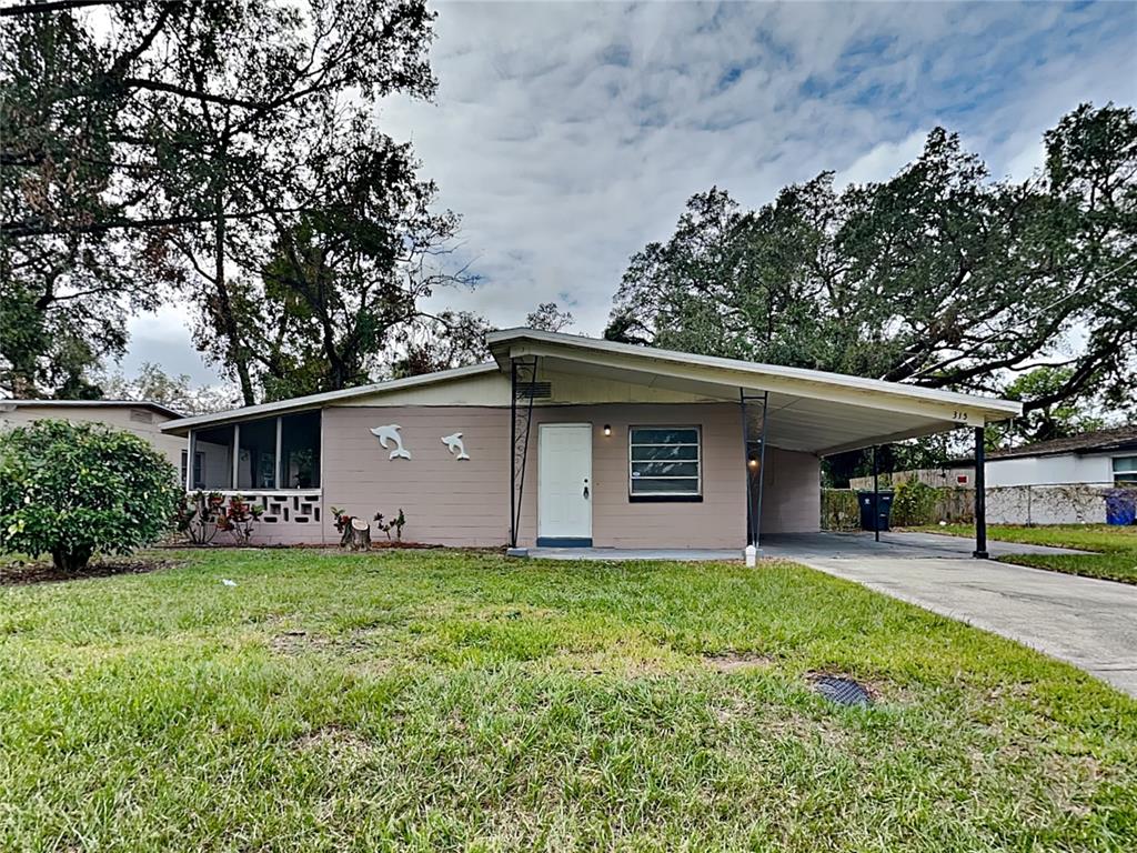 a house that has a tree in front of it