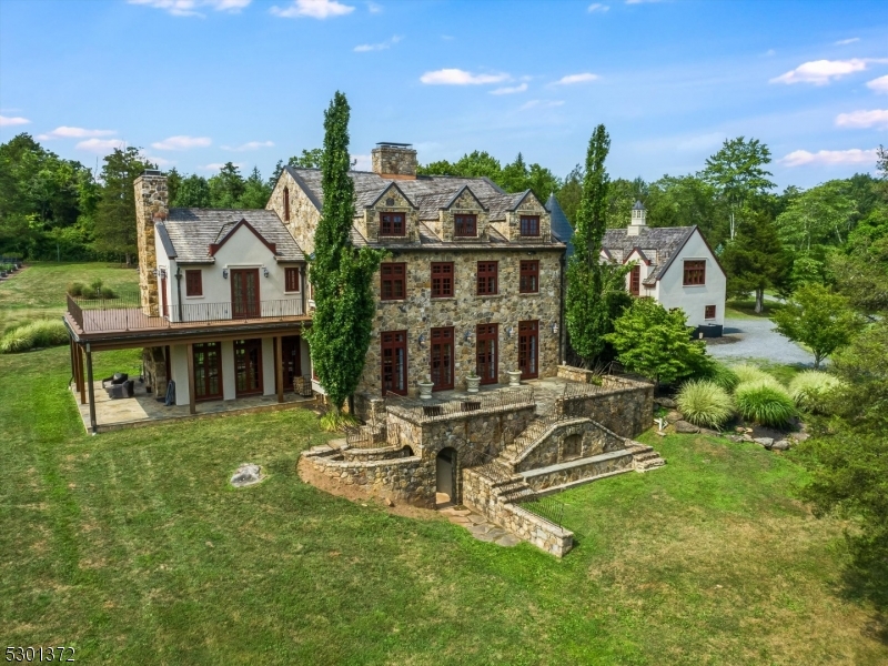 a view of a house with backyard porch and sitting area