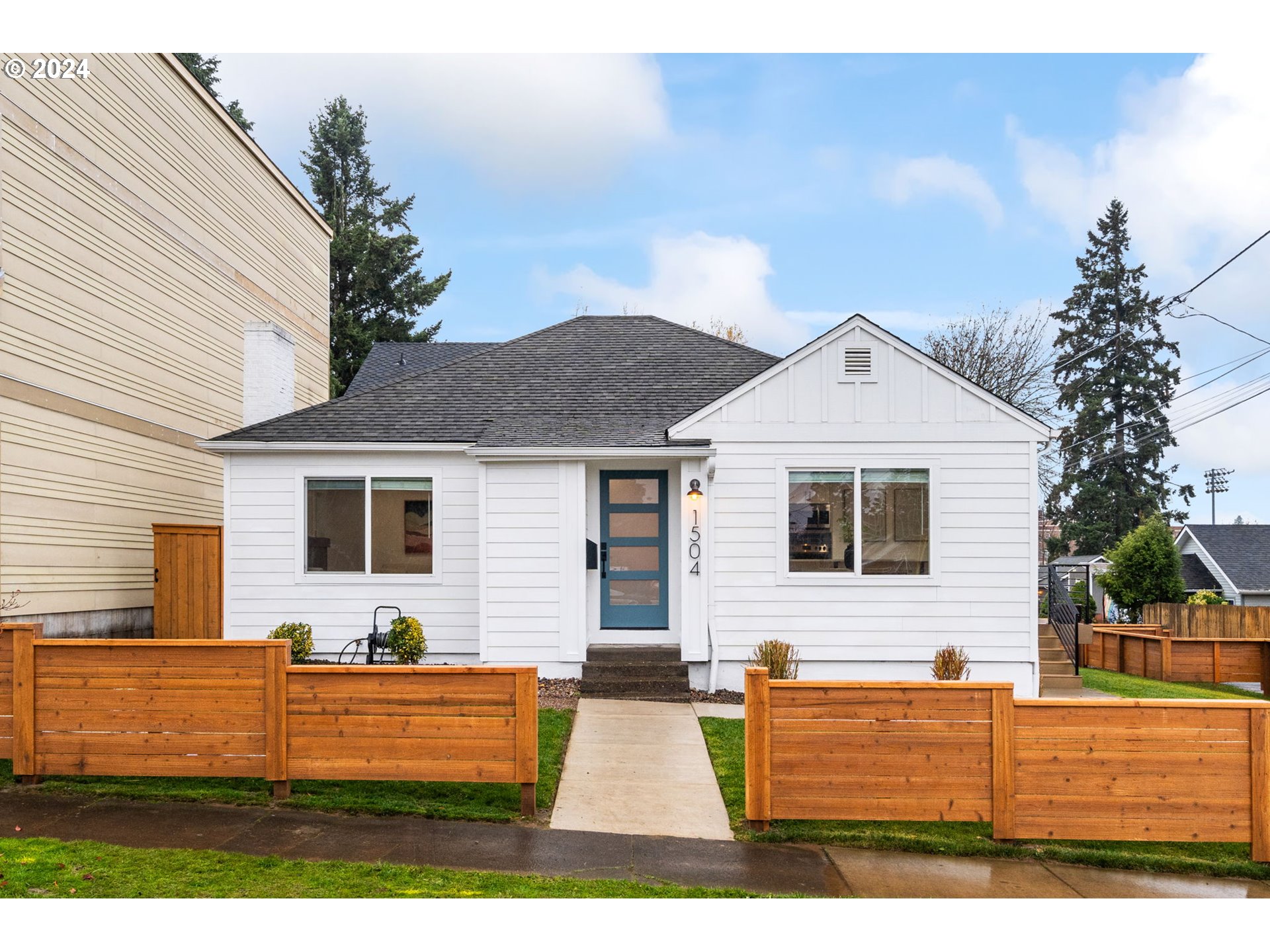 a view of house with a yard