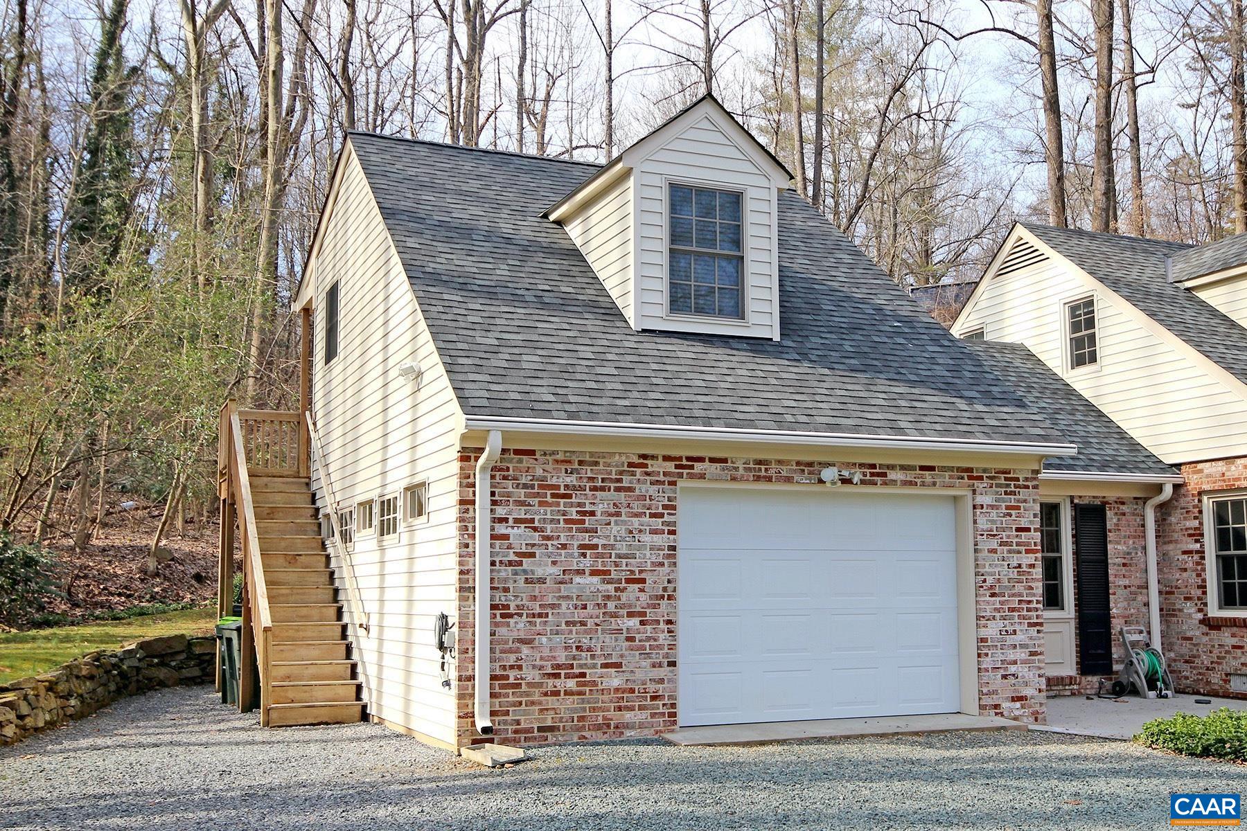 a front view of a house with garage