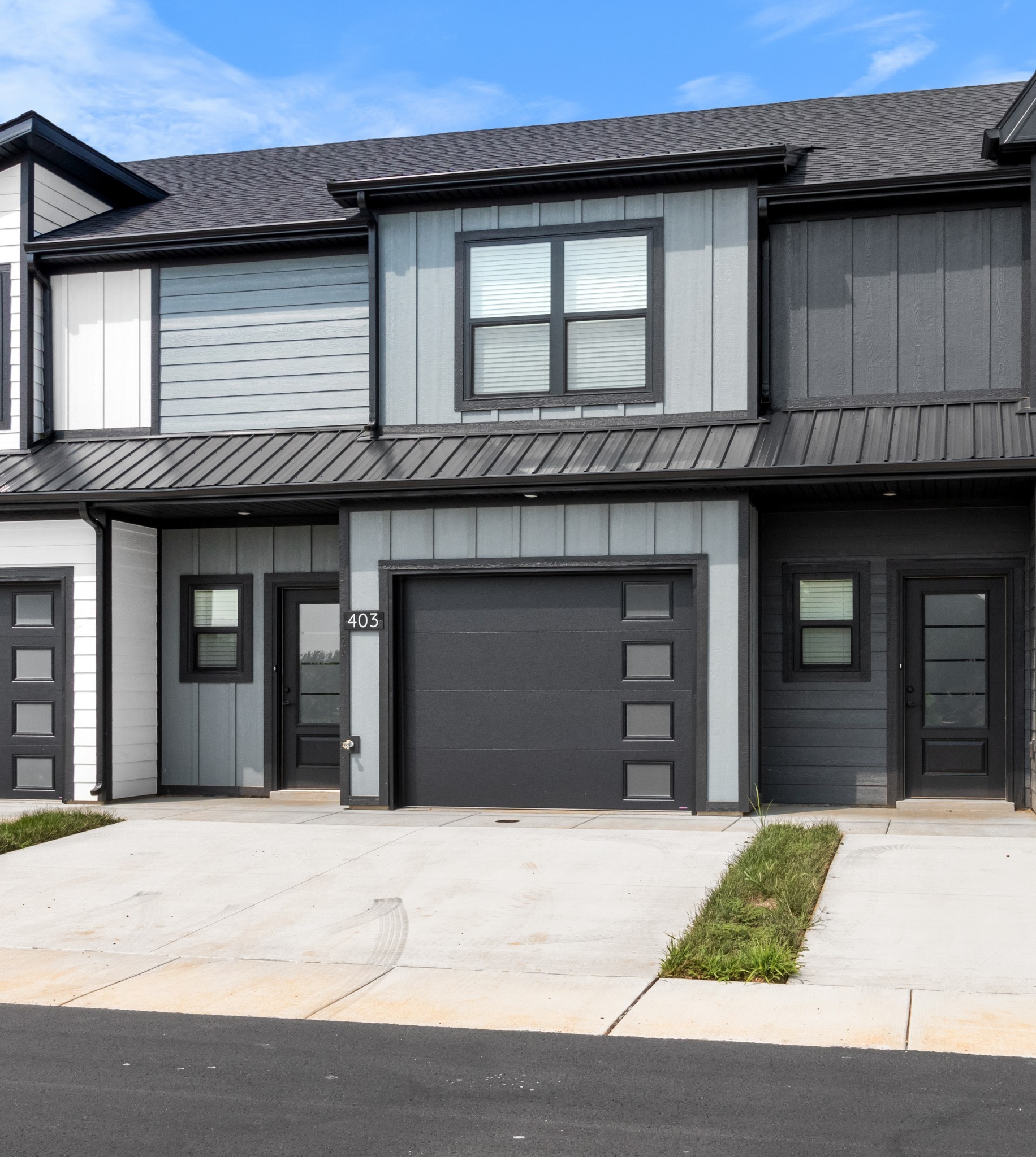 a view of a brick house with a garage