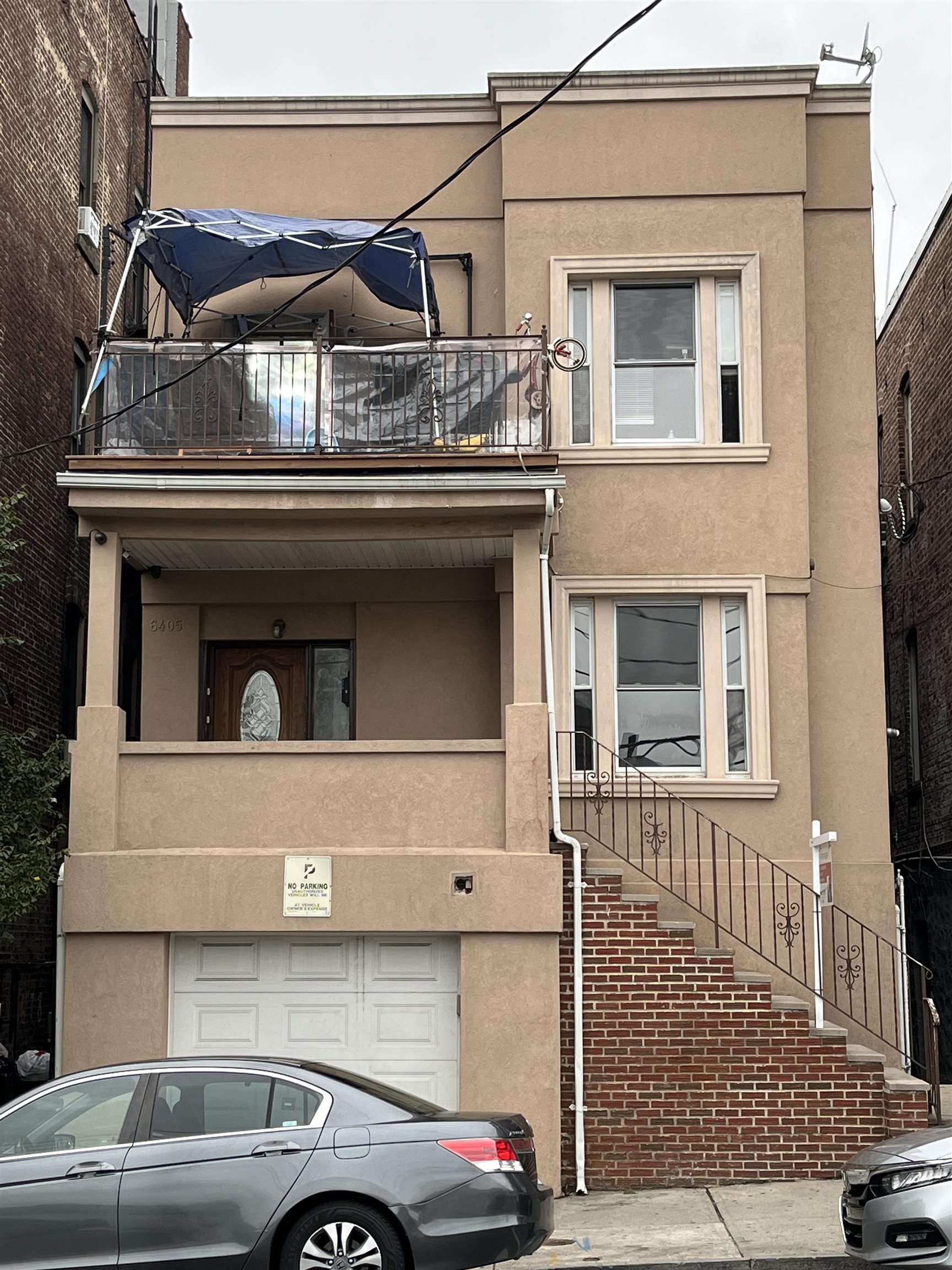 a front view of a house with parking space