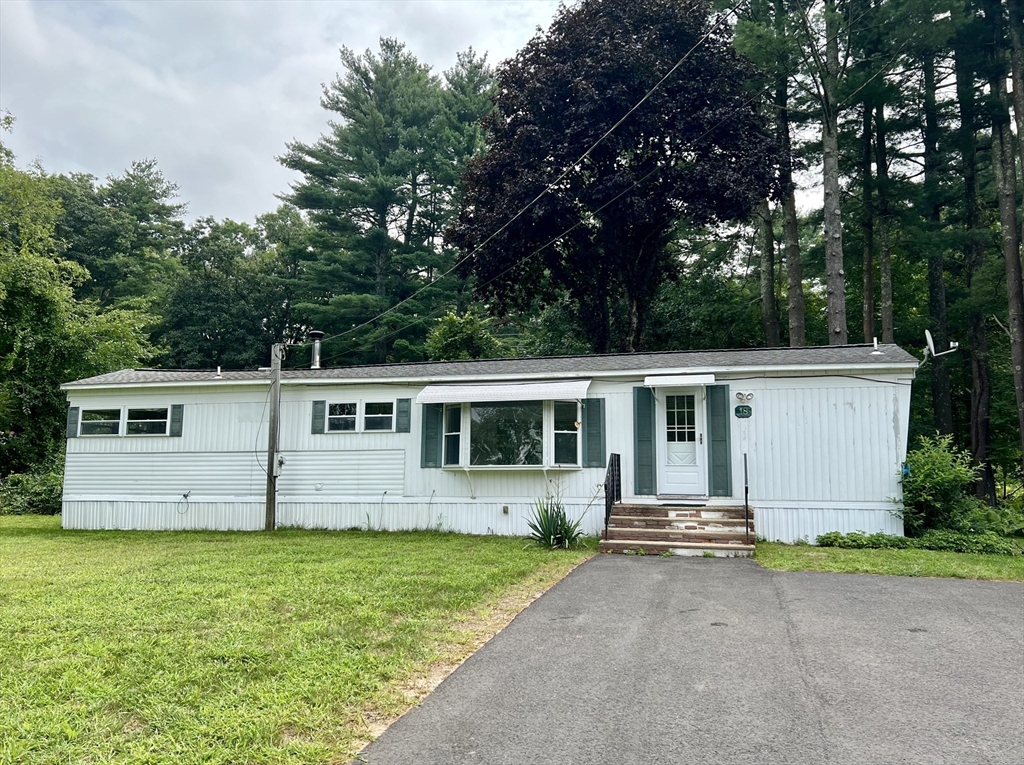 front view of house with a yard