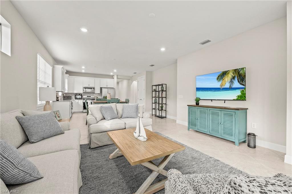 a living room with furniture and a rug