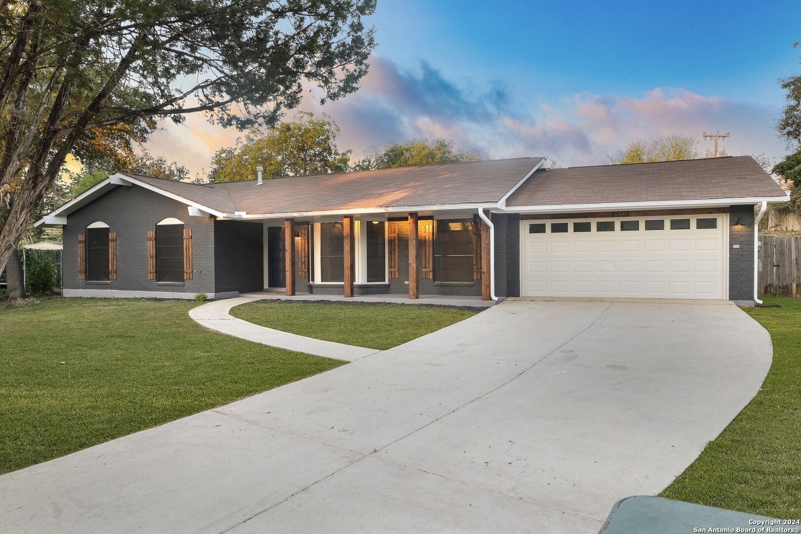 front view of a house with a yard