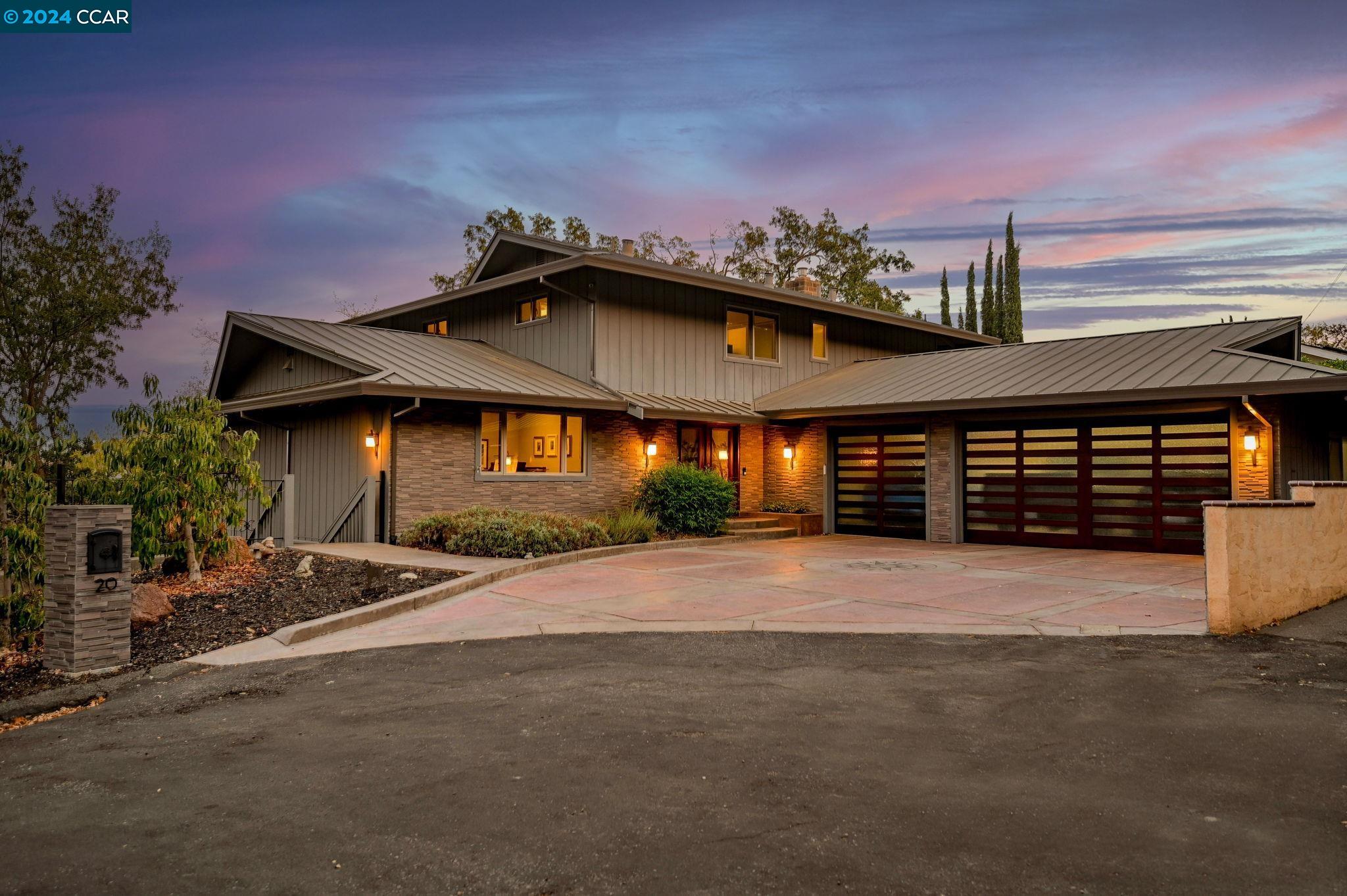 a front view of a house with yard