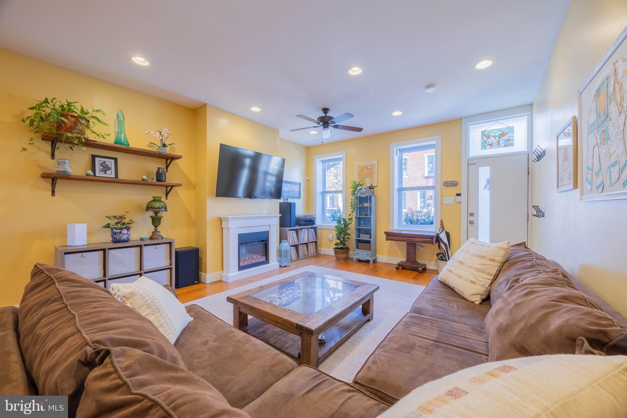 a living room with furniture or couch and a fireplace