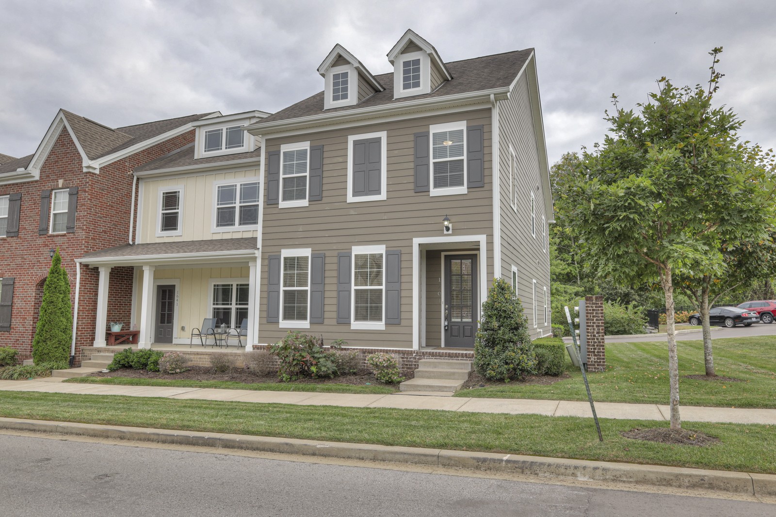 a front view of a house with a yard