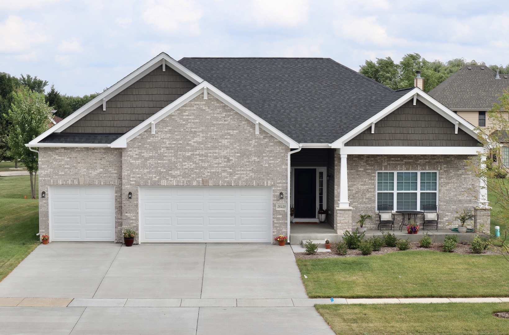 front view of a house with a yard