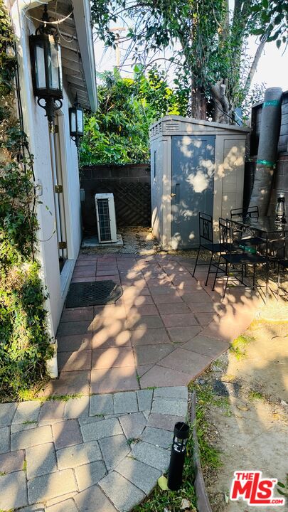 a view of backyard with outdoor seating