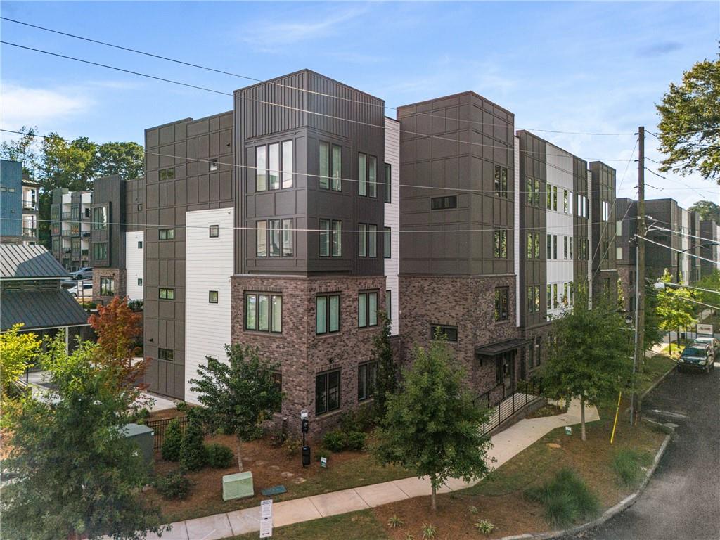 a front view of a building with garden