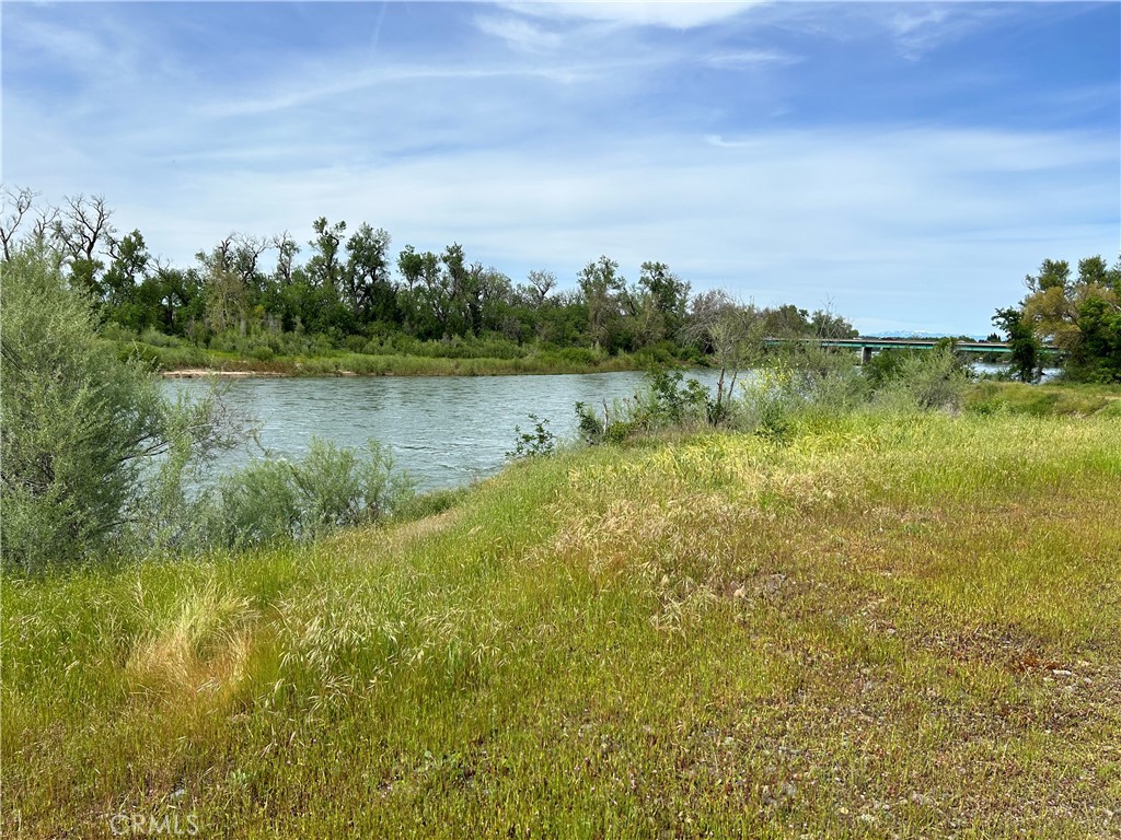 a view of a lake with houses in the back