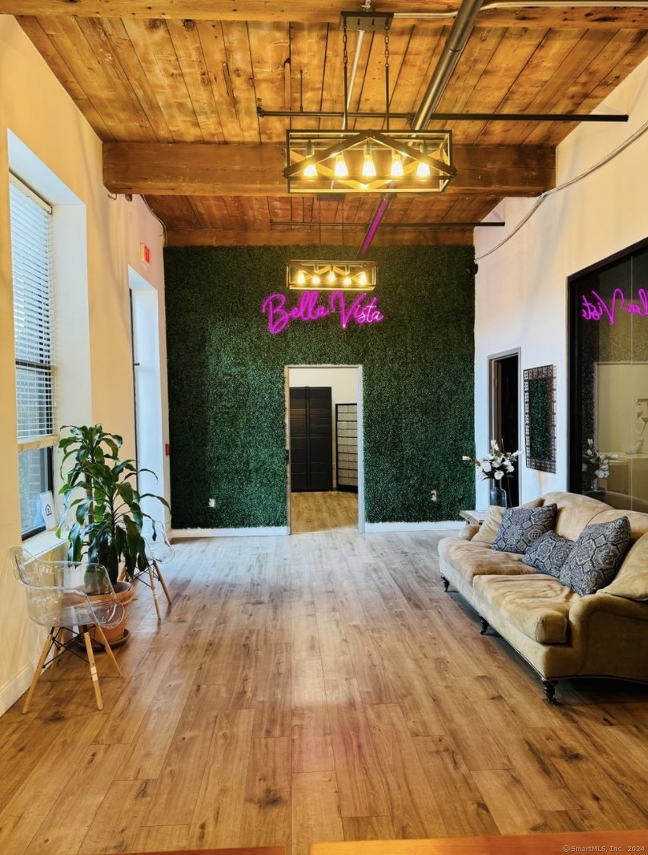 a living room filled with furniture and flowers