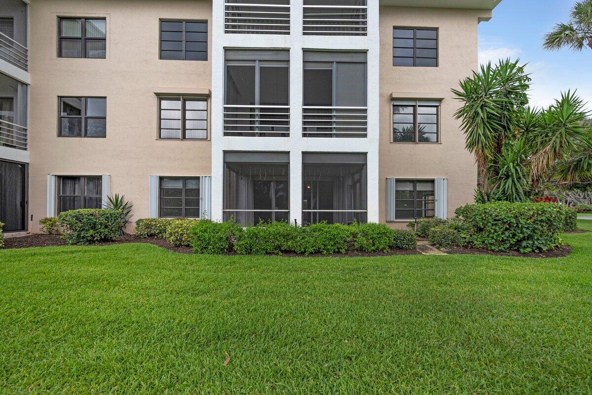 a view of a building next to a yard